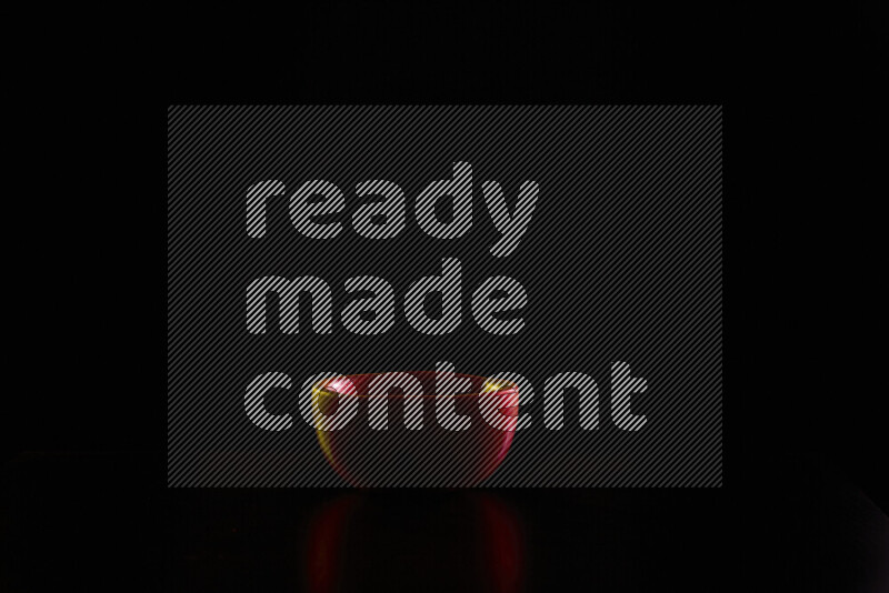 Wooden kitchen essentials with colored rim light against black background