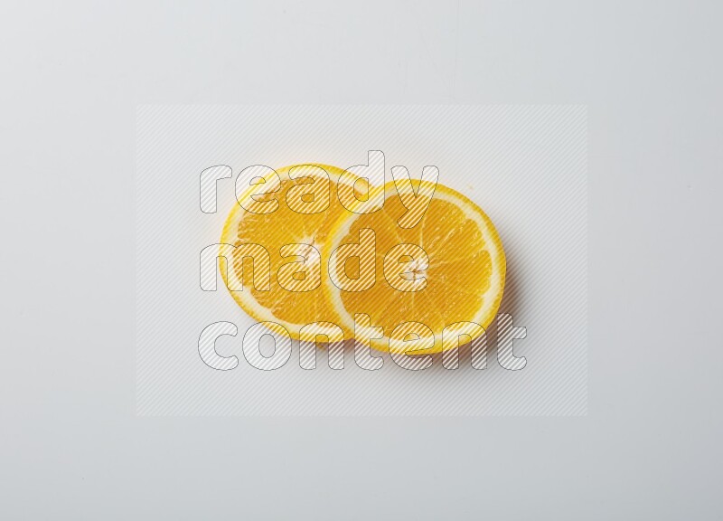 Two orange slices on white background
