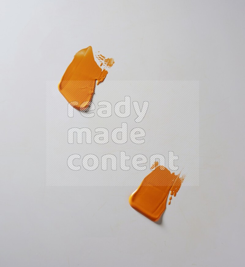 Orange painting knife strokes on white background