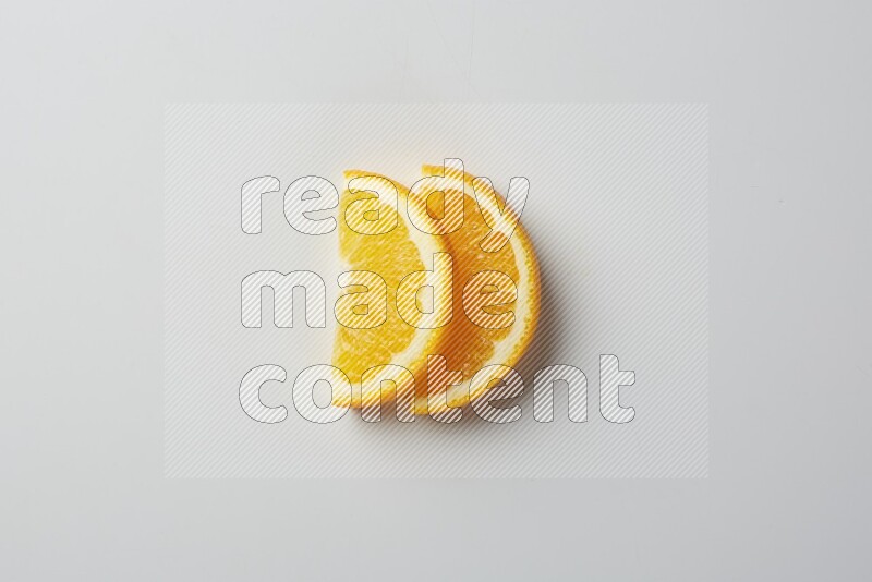Two halves of an orange slices on white background