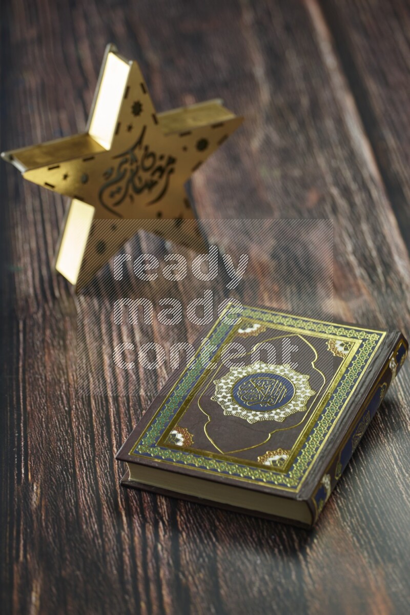 A wooden golden star lantern with different drinks, dates, nuts, prayer beads and quran on brown wooden background