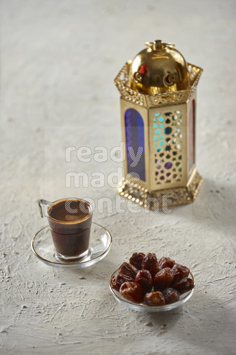 A golden lantern with different drinks, dates, nuts, prayer beads and quran on textured white background