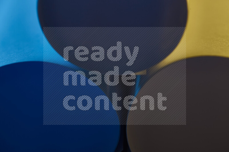 The image shows an abstract paper art with circular shapes in varying shades of blue and warm tones