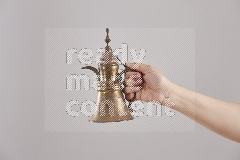 Woman hands holding different metal essentials in different positions