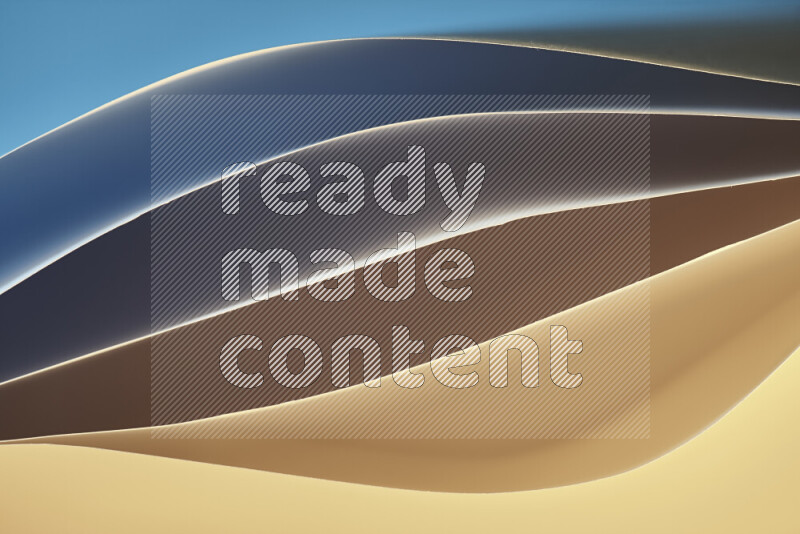 This image showcases an abstract paper art composition with paper curves in blue and yellow gradients created by colored light