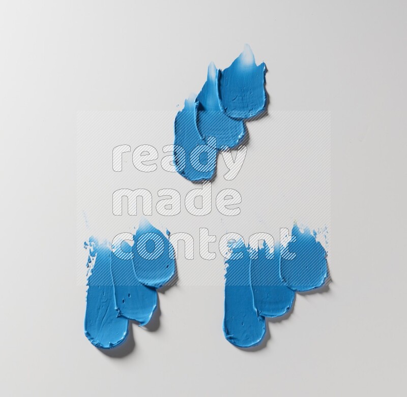 Blue painting knife strokes on white background