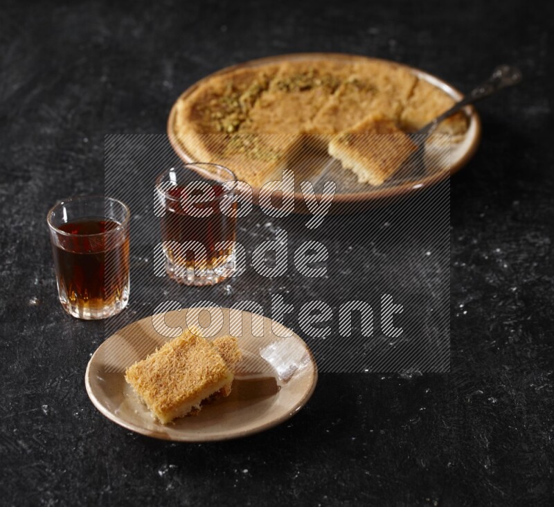konafa with tea in a dark setup