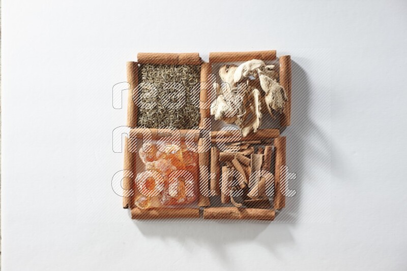 4 squares of cinnamon sticks full of cumin, cinnamon, dried ginger and gum arabic on white flooring