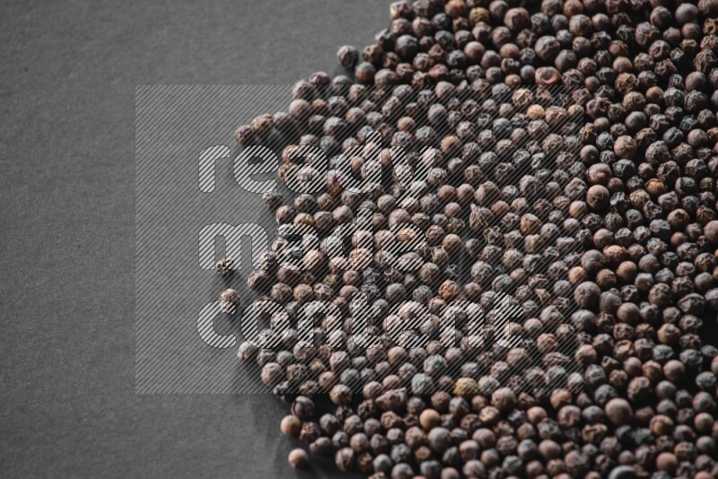 Black pepper on a black flooring