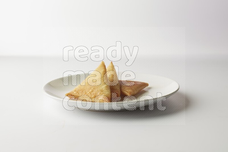 sambosas on a white background