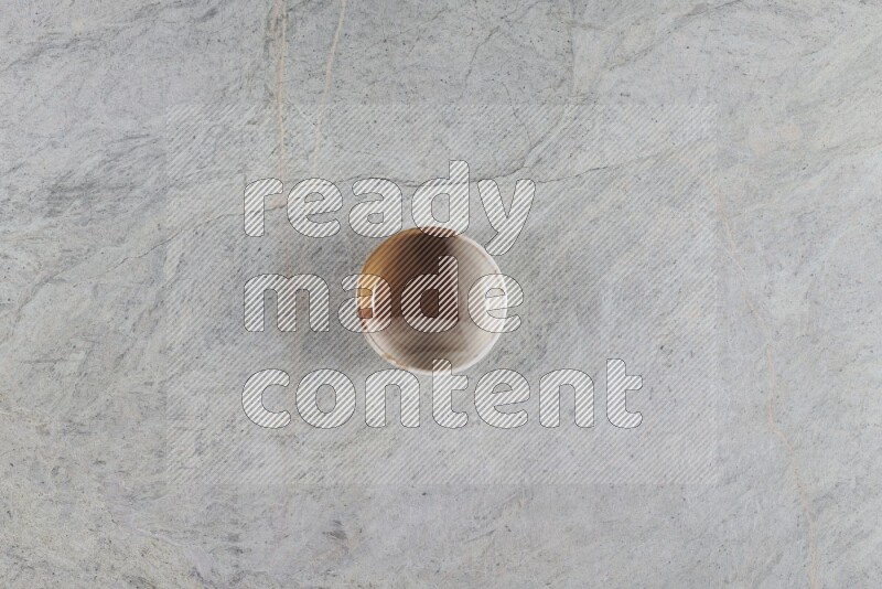 A multicolored pottery Bowl on grey marble background
