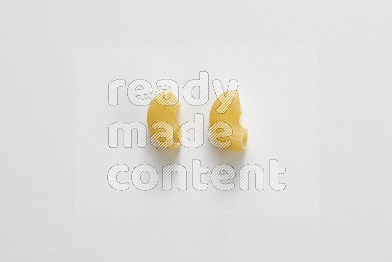 Elbow pasta on white background