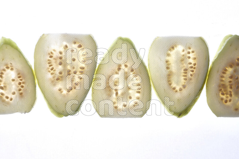 Guava slices on illuminated white background
