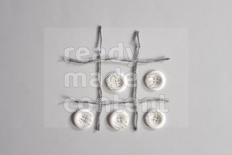 White buttons placed on grey background