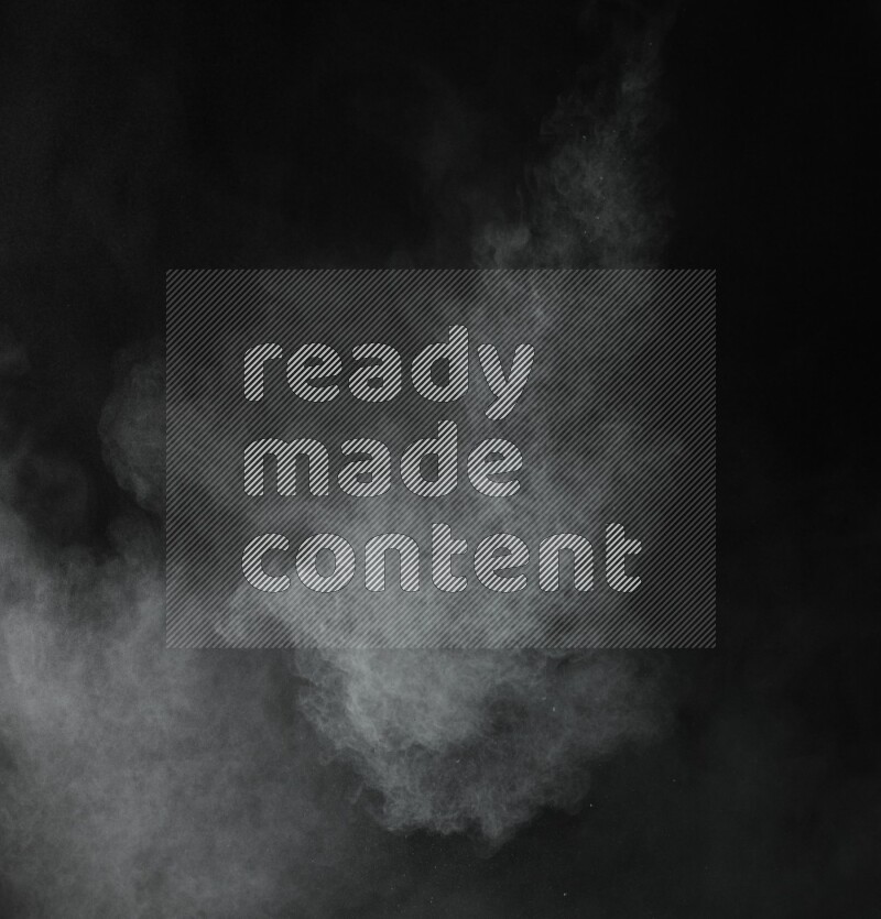 A side view of green powder explosion on black background