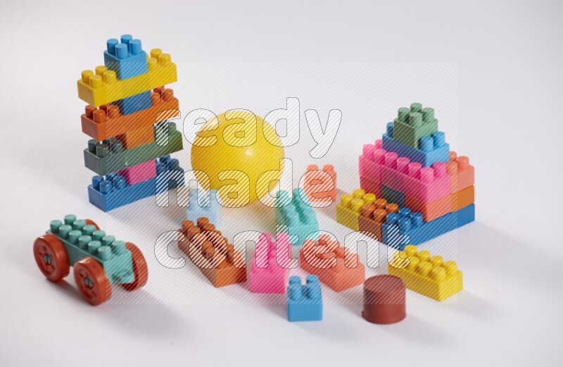 Collection of colorful different kids toys on white background