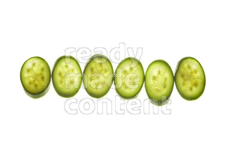 Zucchini slices on illuminated white background