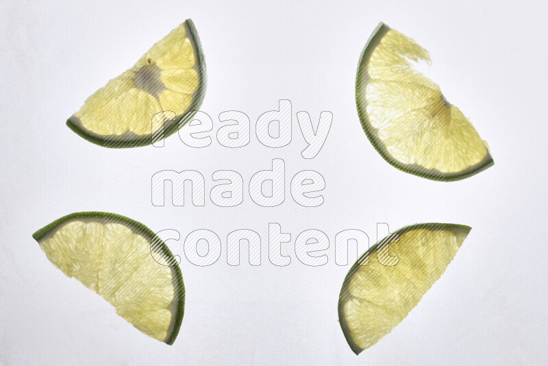 Orange slices on illuminated white background