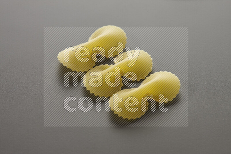 Fiocchi pasta on grey background