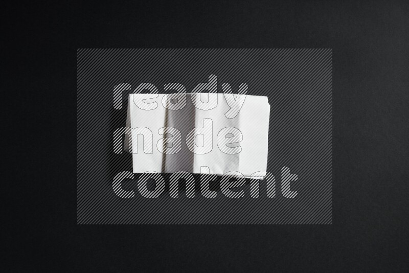 White paper sheet on black background