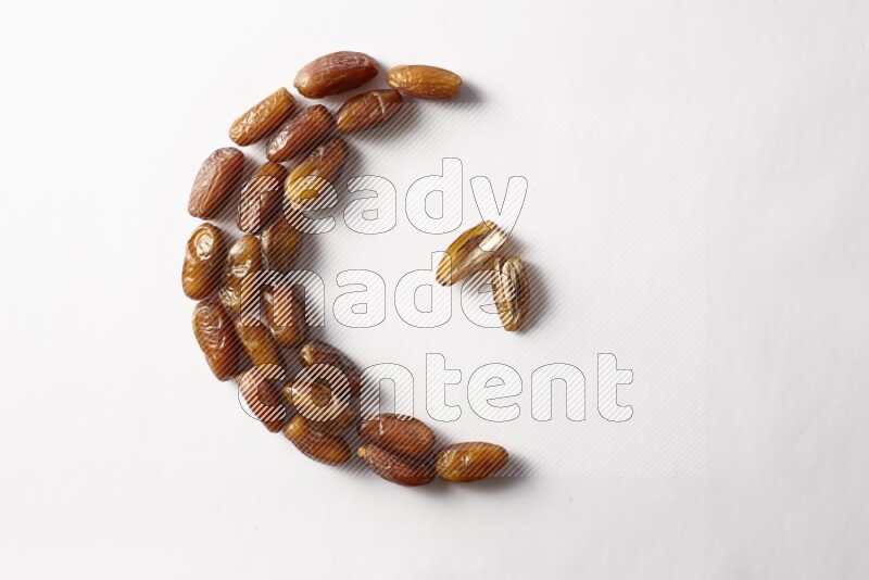 Dates in a crescent shape on white background