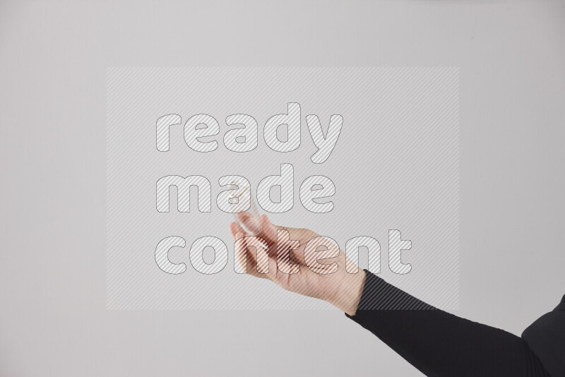 A woman in black abaya holding different glassware in different positions