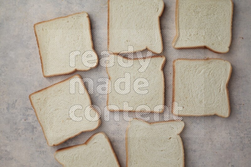 White Toast slices on alight blue textured background