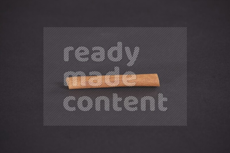 Cinnamon stick on black background