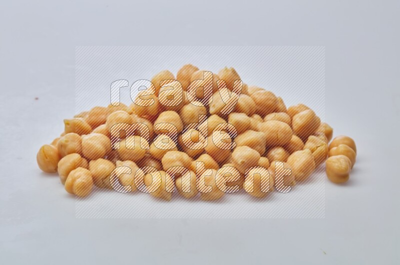 Close up shot of boiled chickpeas on white background
