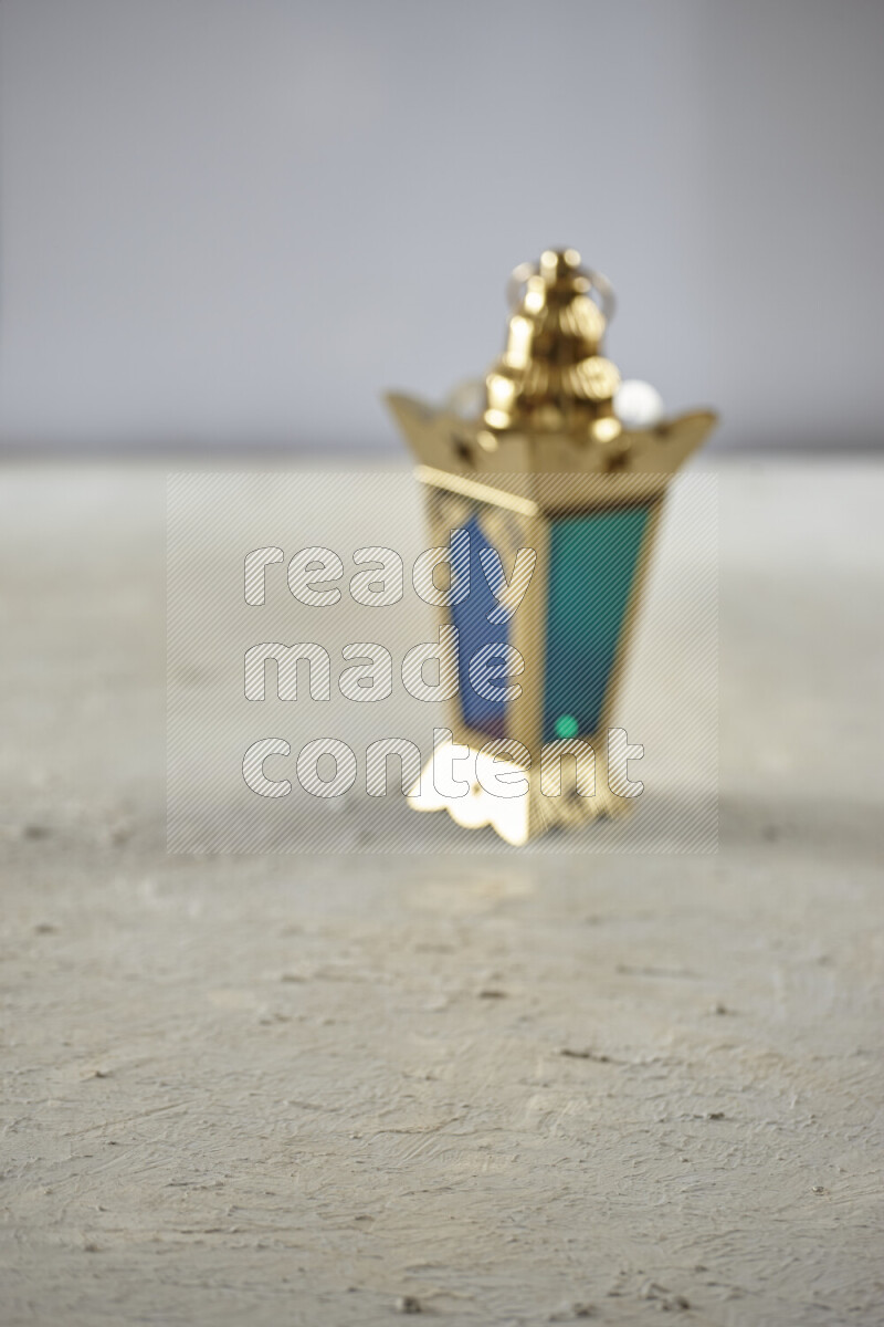 A lantern placed on a textured white background