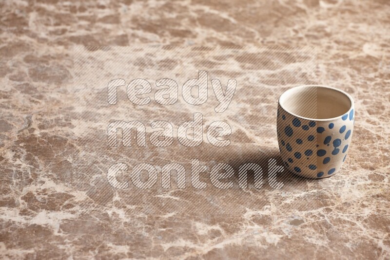 Pottery Cup on Beige Marble Flooring