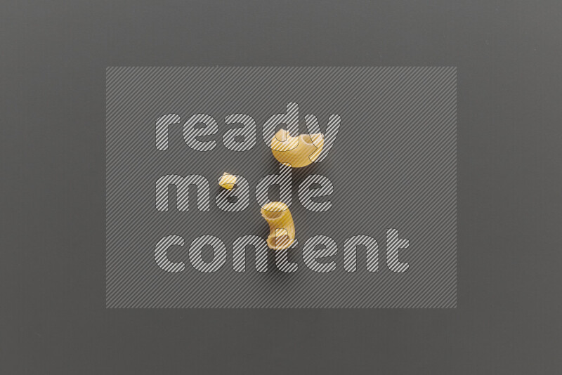 Different pasta types on grey background