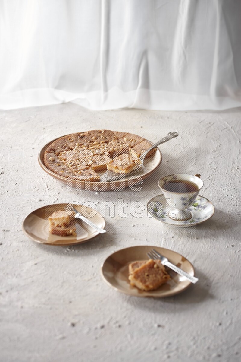 Basbousa with tea in a light setup