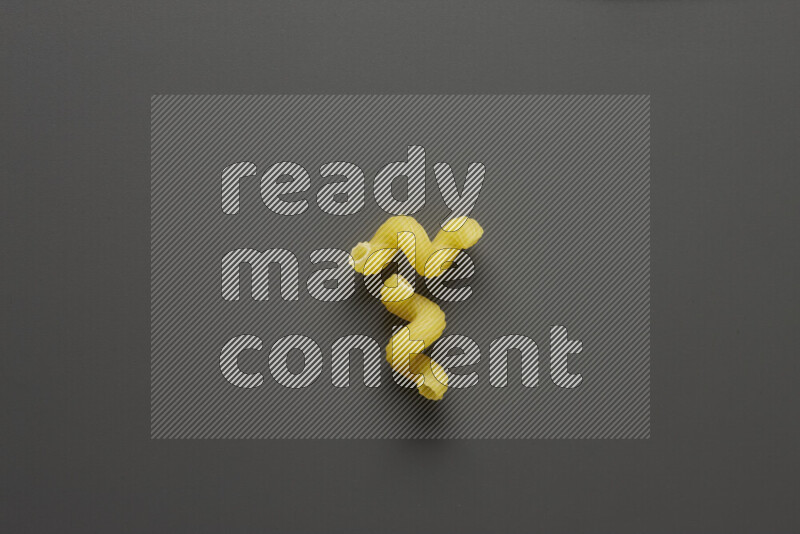Twist pasta on grey background