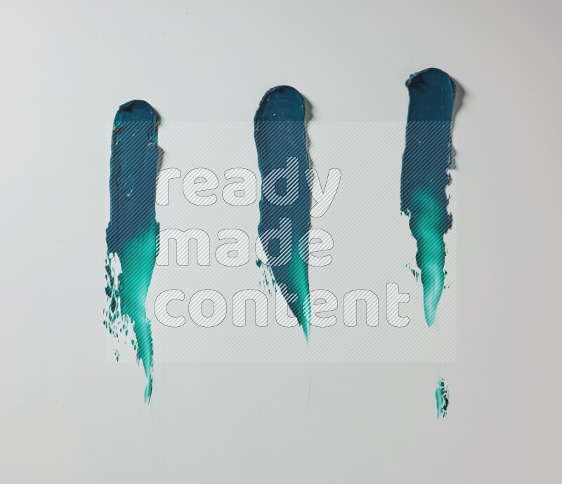 Turquoise painting knife strokes on white background