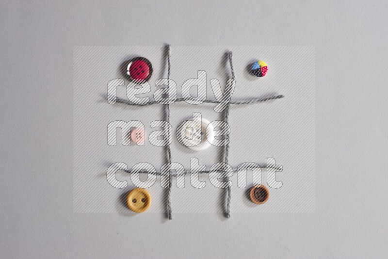 Multicolored buttons placed on grey background