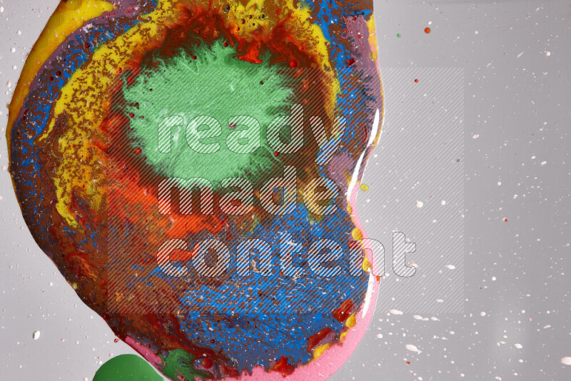 Close-ups of assorted colors blending on a grey background