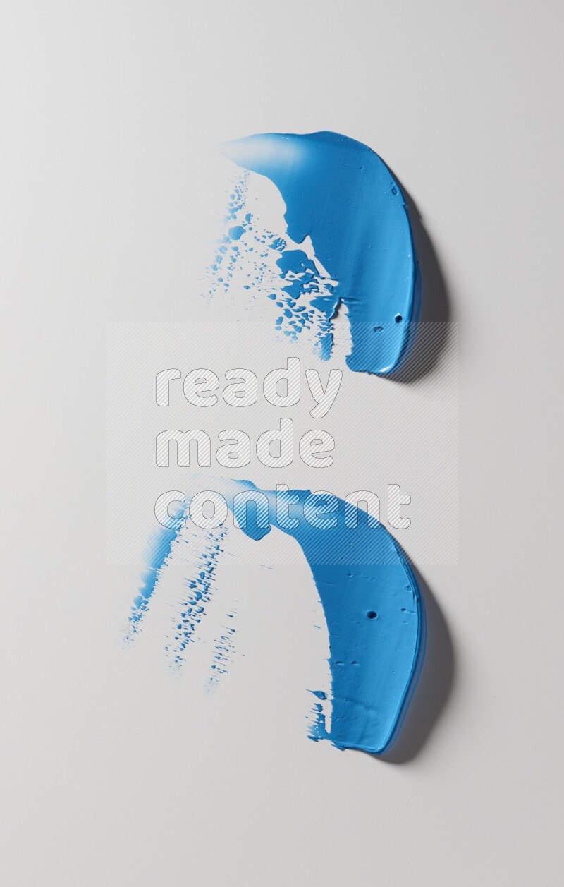 Blue painting knife strokes on white background