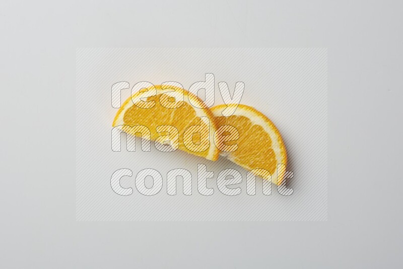 Two halves of an orange slices on white background