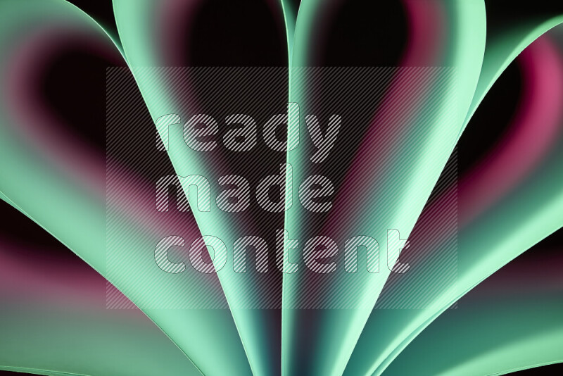 An abstract art piece displaying smooth curves in pink and green gradients created by colored light