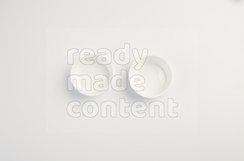white ceramic round sauce dish on white countertop