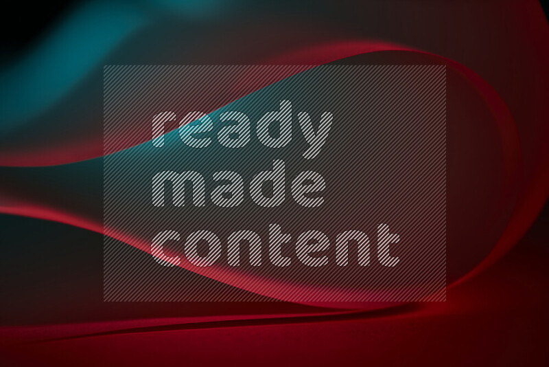 فن تجريدي يعرض منحنيات وتدرجات اللون الأزرق والأحمر مكونه بضوء ملون