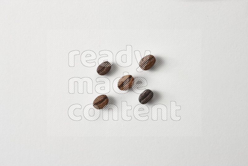 Roasted coffee beans on white background