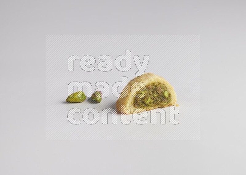 Half Maamoul filled with pistachio direct on white background