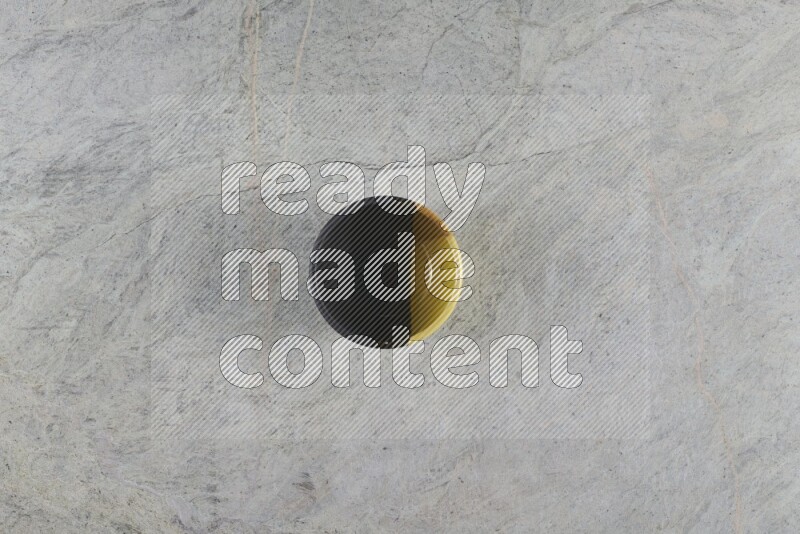 A multicolored pottery Bowl on grey marble background