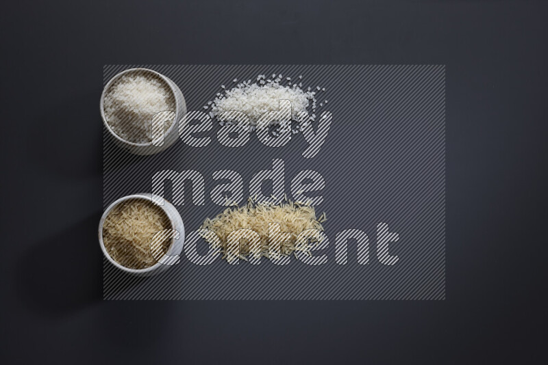 Legumes in pottery bowls on grey background