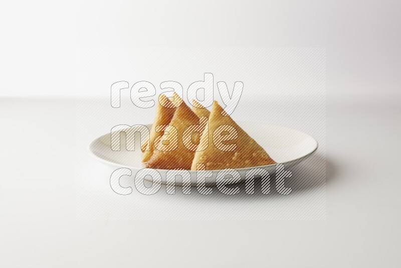 sambosas on a white background