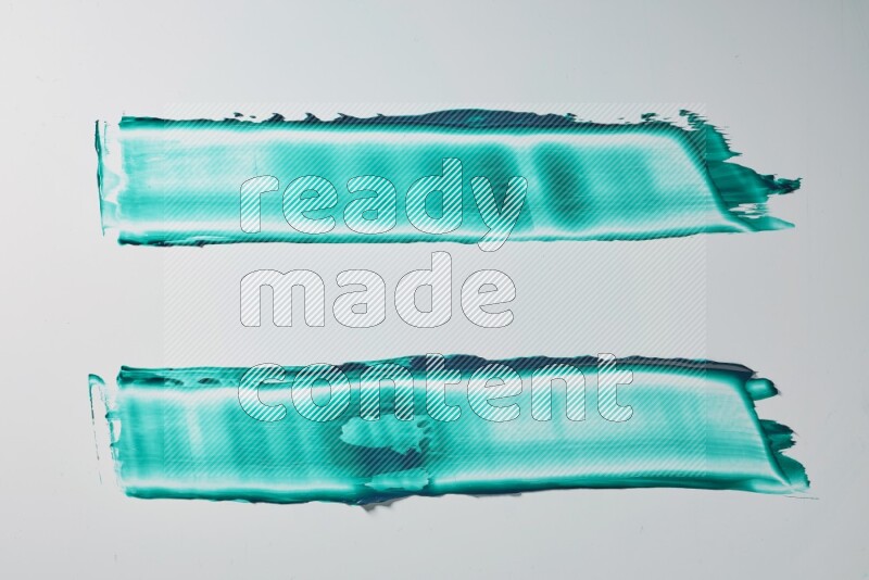 Turquoise painting knife strokes on white background