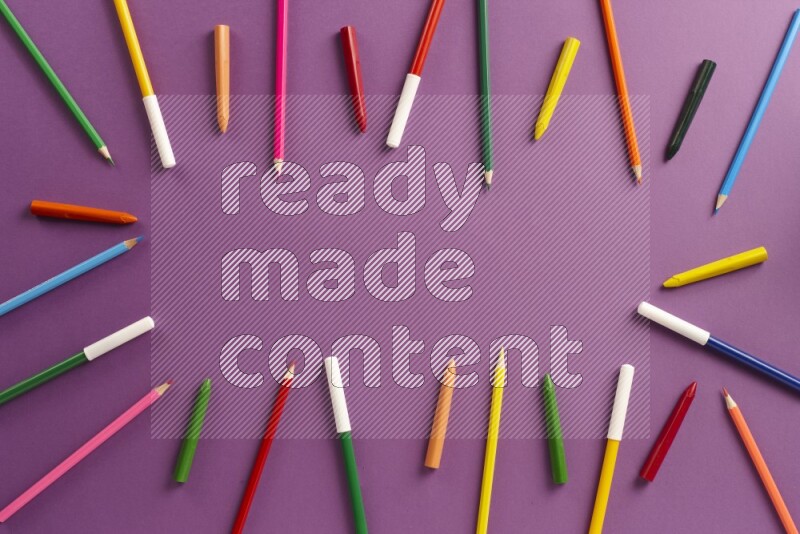 Different school supplies on purple background