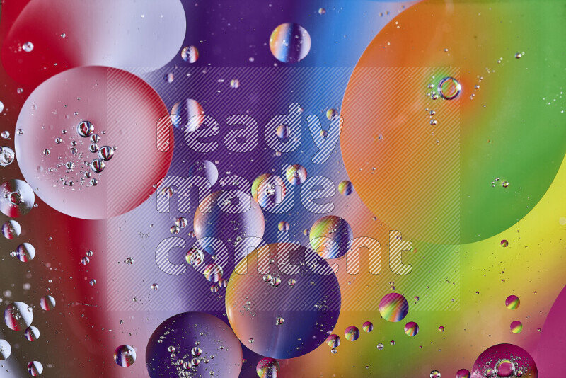 Close-ups of abstract oil bubbles on water surface in multicolors